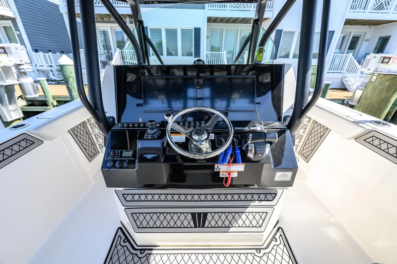 Jokers Jewel Yacht Photos Pics 2019 Wellcraft 352 Fisherman boat console with steering wheel and controls.