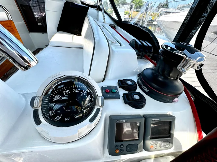  Yacht Photos Pics Cockpit of 2011 Jeanneau Sun Odyssey 409 with compass and navigation instruments.