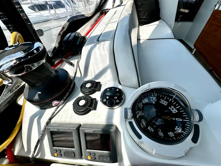  Yacht Photos Pics Cockpit of 2011 Jeanneau Sun Odyssey 409 sailboat with navigation instruments and compass.