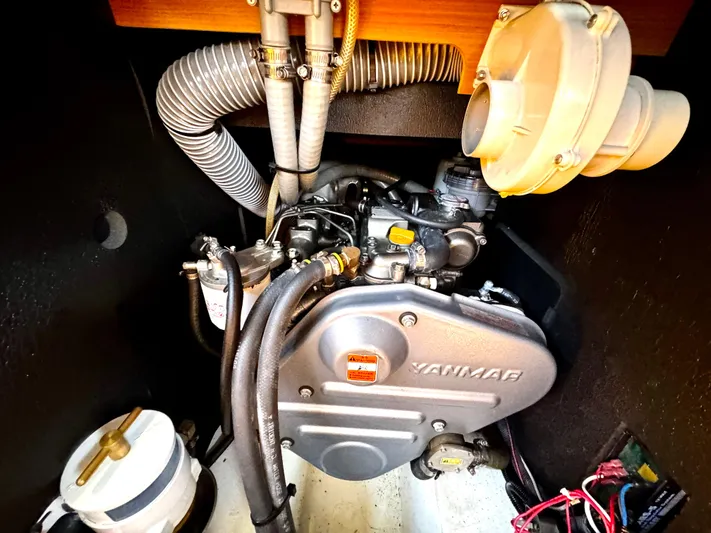  Yacht Photos Pics Engine compartment of a 2011 Jeanneau Sun Odyssey 409 sailboat, featuring a Yanmar engine.