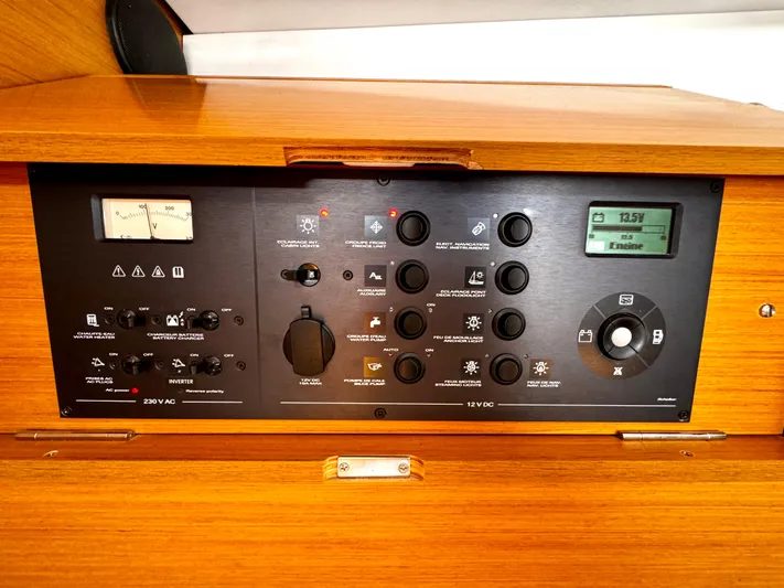  Yacht Photos Pics Control panel of 2011 Jeanneau Sun Odyssey 409 sailboat, featuring various switches and gauges.