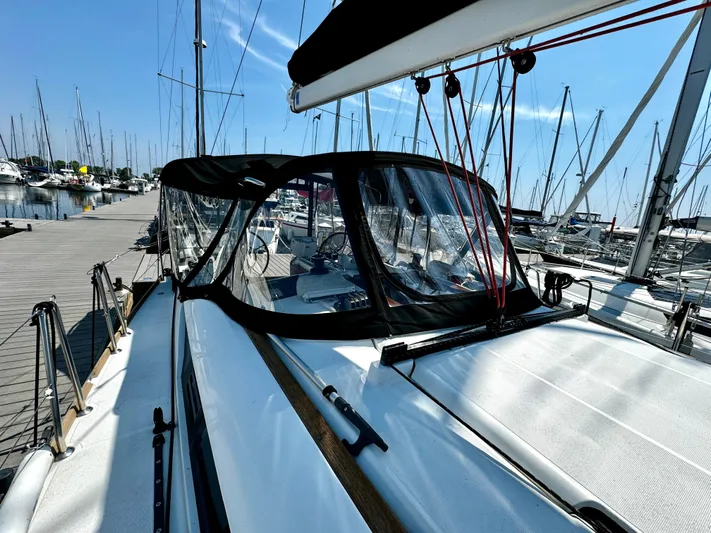  Yacht Photos Pics Jeanneau Sun Odyssey 409 sailboat docked at marina, showcasing sleek design and rigging.