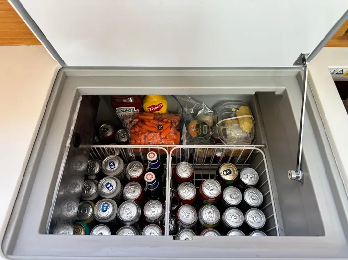  Yacht Photos Pics Open fridge on Jeanneau Sun Odyssey 409 yacht, stocked with drinks and condiments.
