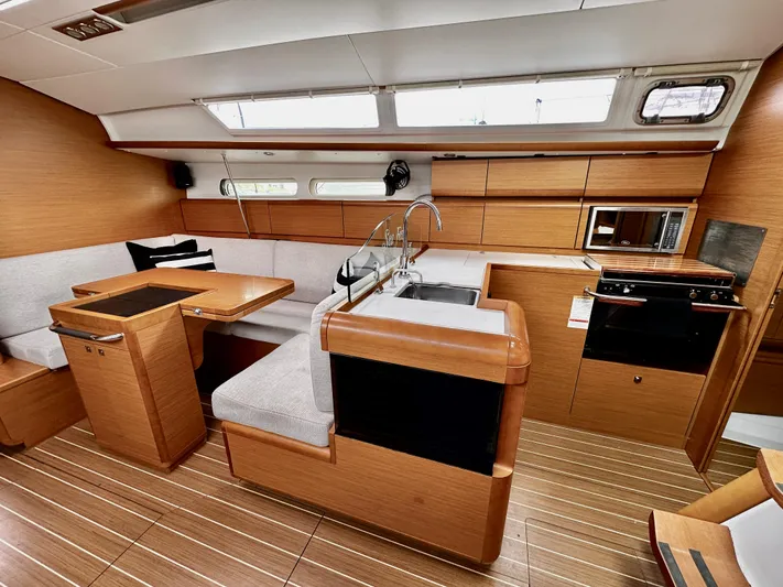  Yacht Photos Pics Interior of 2011 Jeanneau Sun Odyssey 409 yacht with modern kitchen and seating area.