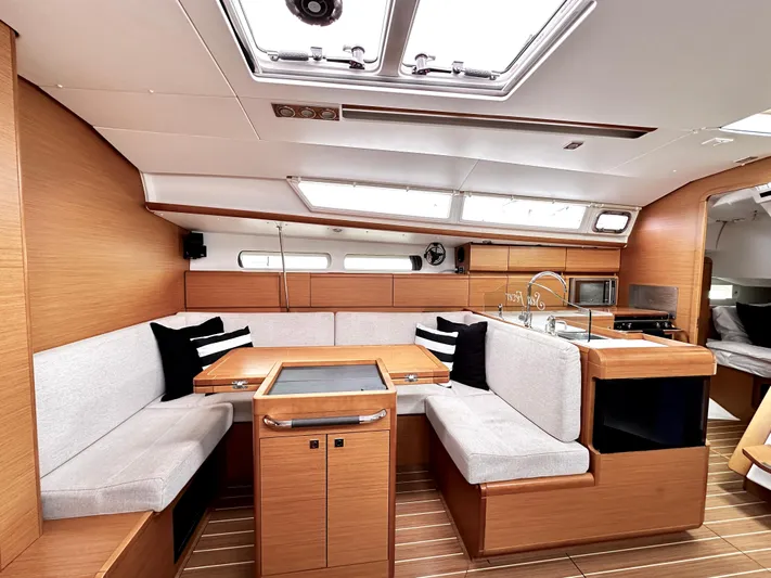  Yacht Photos Pics Interior of 2011 Jeanneau Sun Odyssey 409 yacht with modern seating and kitchen area.