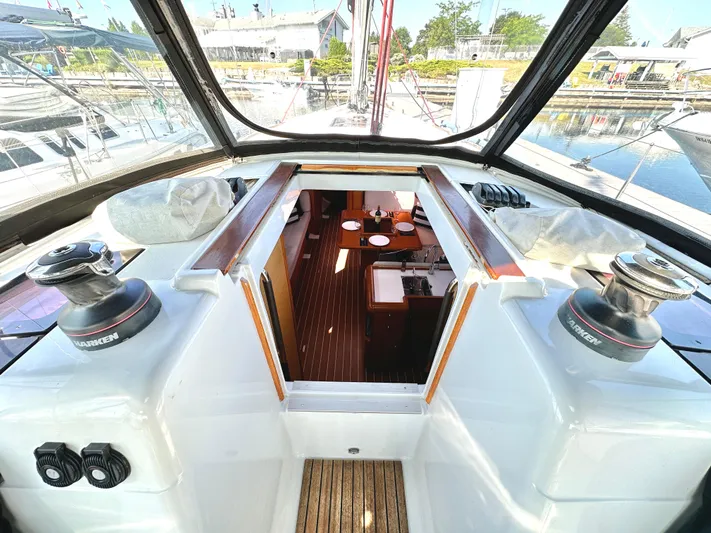  Yacht Photos Pics Interior view of 2011 Jeanneau Sun Odyssey 409 sailboat, showcasing cockpit and cabin.
