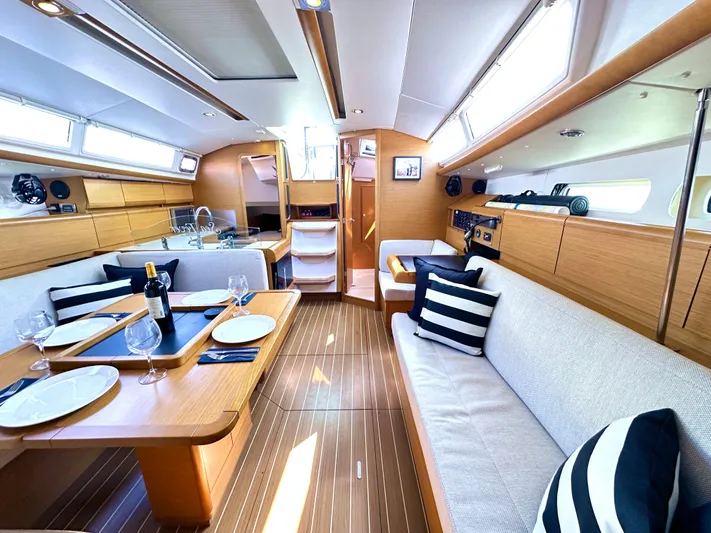  Yacht Photos Pics Luxurious interior of 2011 Jeanneau Sun Odyssey 409 yacht with elegant dining area.