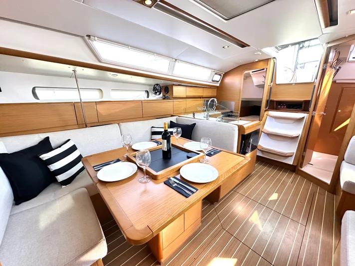  Yacht Photos Pics Luxurious interior of 2011 Jeanneau Sun Odyssey 409 yacht with elegant dining area.