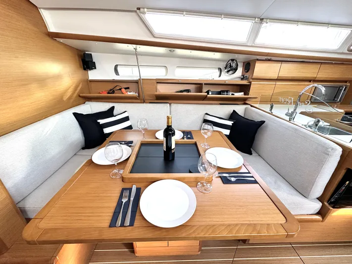  Yacht Photos Pics Interior of 2011 Jeanneau Sun Odyssey 409 yacht with elegant dining setup.