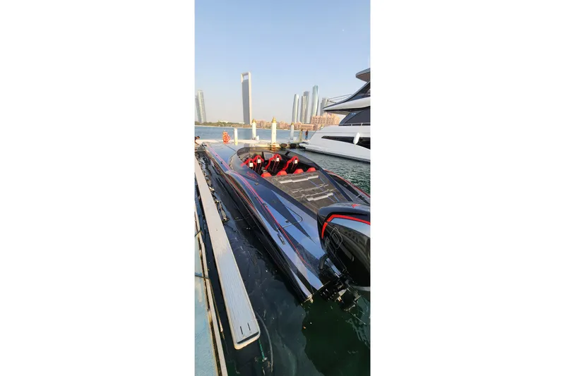  Yacht Photos Pics Luxury MTI 440X speedboat docked, 2025 model, with city skyline in background.