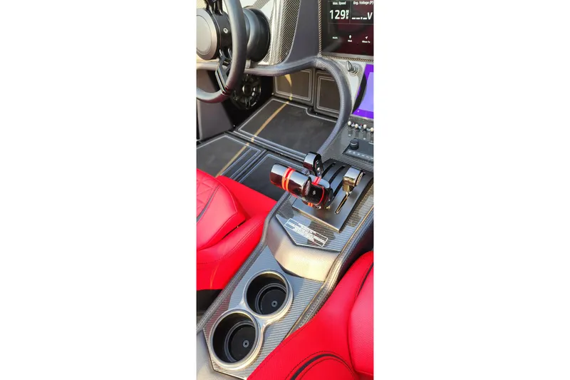  Yacht Photos Pics Interior of 2025 MTI 440X with red seats and carbon fiber console.