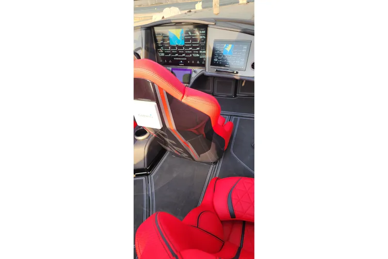  Yacht Photos Pics Interior of 2025 MTI 440X with red seats and advanced navigation displays.