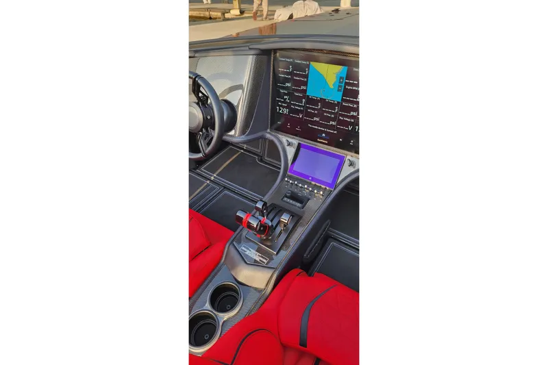  Yacht Photos Pics Interior of 2025 MTI 440X with advanced dashboard and red seating.
