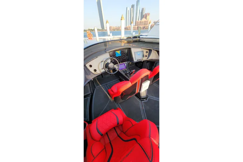  Yacht Photos Pics Interior of 2025 MTI 440X boat with red seats and modern dashboard.