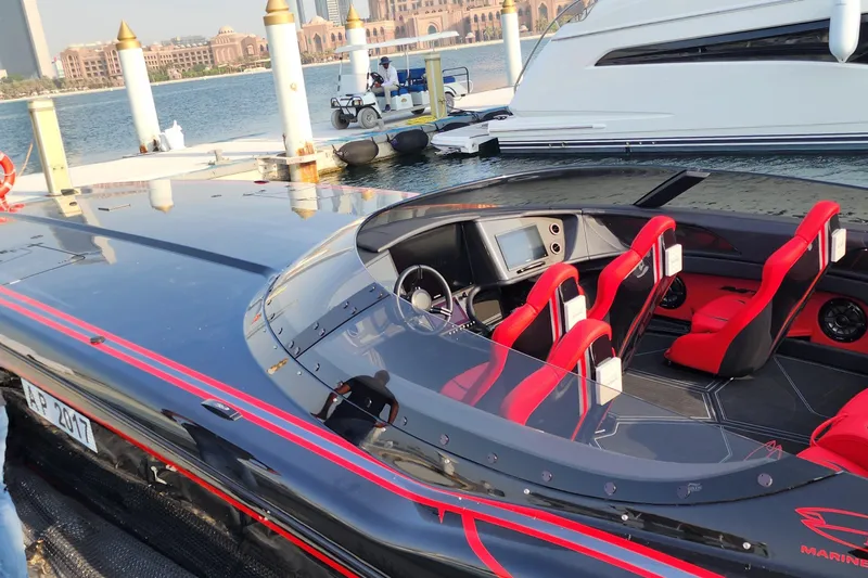  Yacht Photos Pics Luxury MTI 440X speedboat with red seats docked at marina, 2025 model.