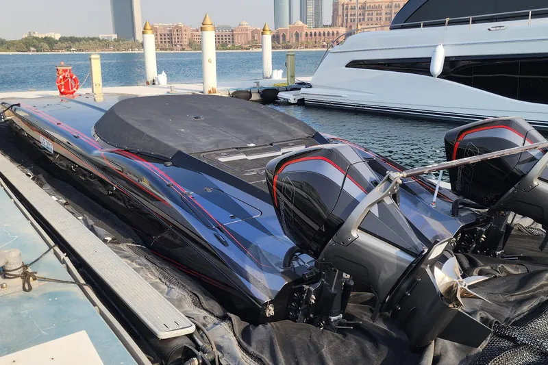  Yacht Photos Pics High-performance MTI 440X powerboat docked, showcasing sleek design and dual engines, 2025 model.