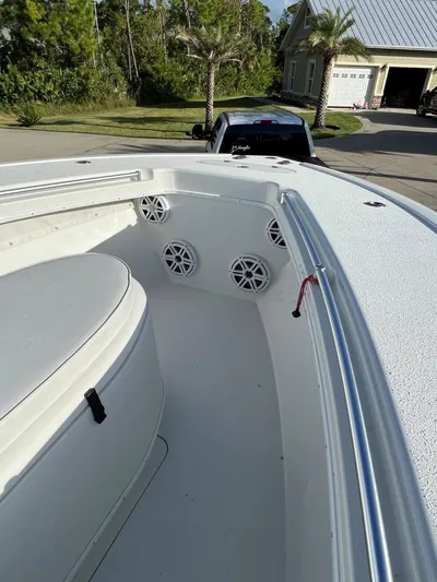 32 Yellowfin Yacht Photos Pics 2016 Yellowfin 32 Offshore boat interior with speakers, parked in a residential driveway.