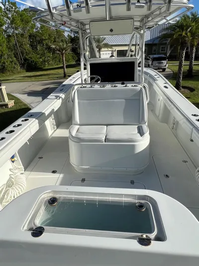 32 Yellowfin Yacht Photos Pics 2016 Yellowfin 32 Offshore boat with spacious deck and seating, ideal for fishing and leisure.
