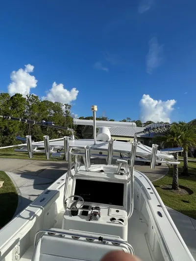 32 Yellowfin Yacht Photos Pics 2016 Yellowfin 32 Offshore boat with clear blue sky and lush greenery.