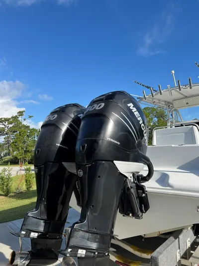 32 Yellowfin Yacht Photos Pics 2016 Yellowfin 32 Offshore boat with twin Mercury outboard engines, under clear blue sky.