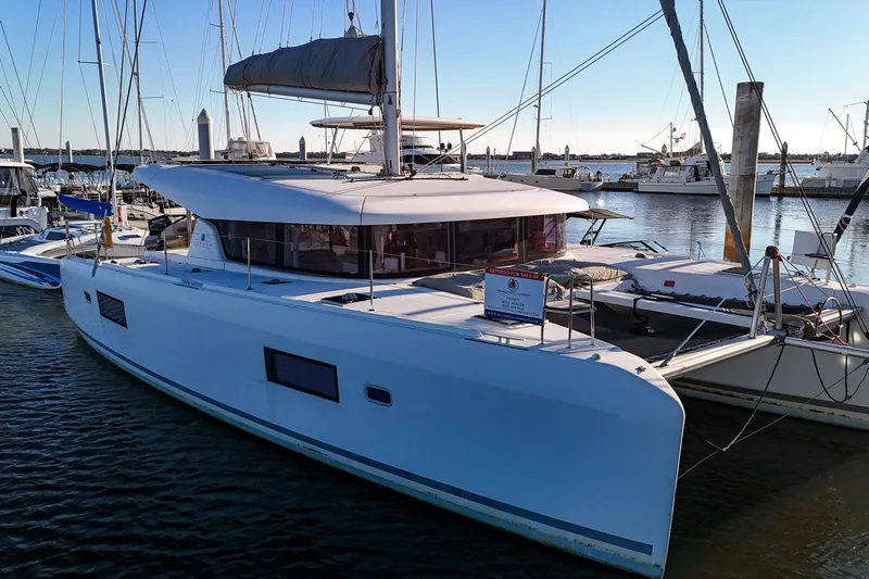 Curvy Mermaid Yacht Photos Pics 2017 Lagoon 42 Owners Version catamaran docked at marina, available for sale.