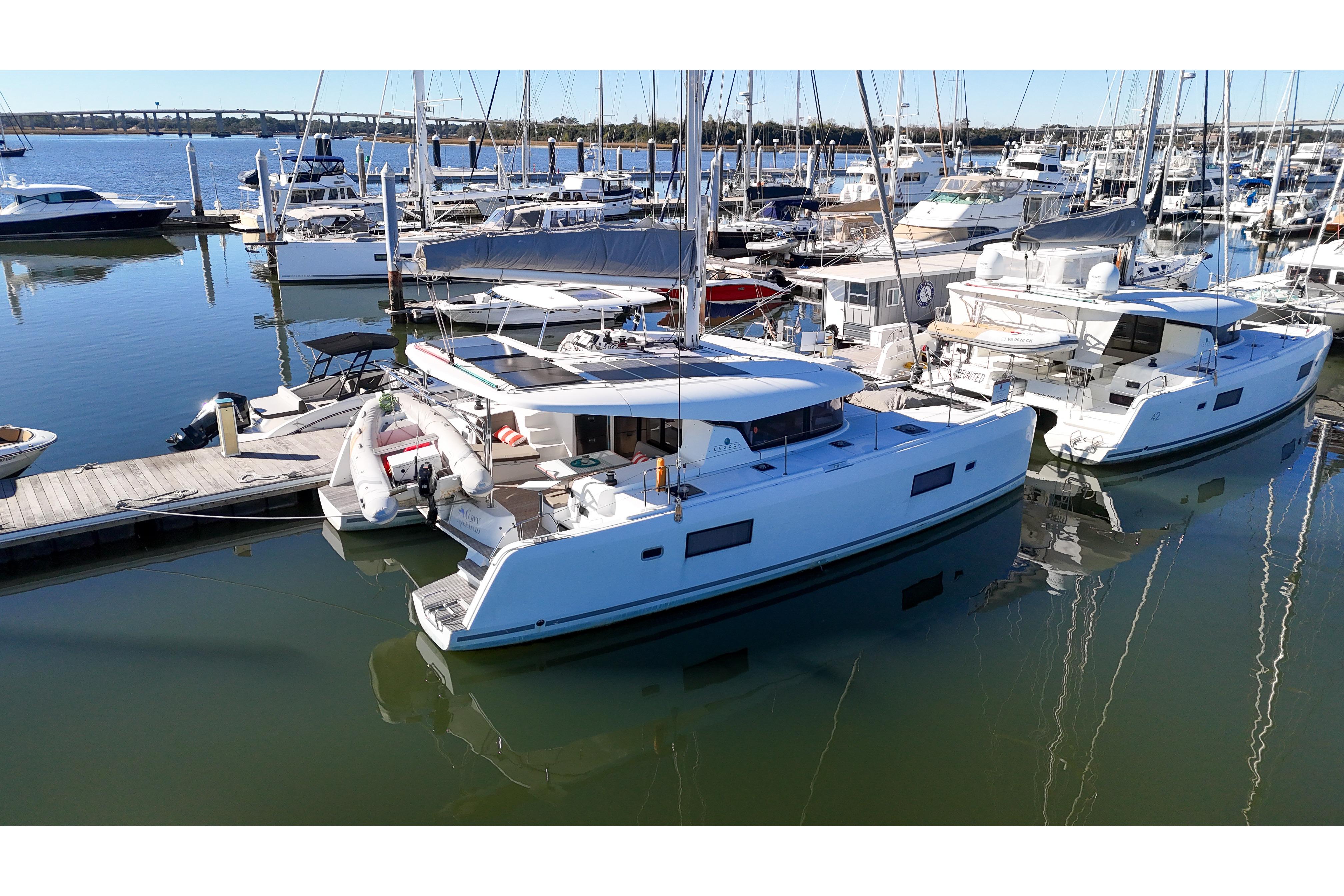 2017 Lagoon 42 Owners Version catamaran docked in a marina.