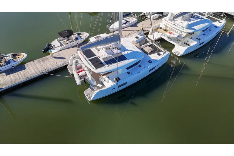Curvy Mermaid Yacht Photos Pics Aerial view of 2017 Lagoon 42 Owners Version catamaran docked at marina.