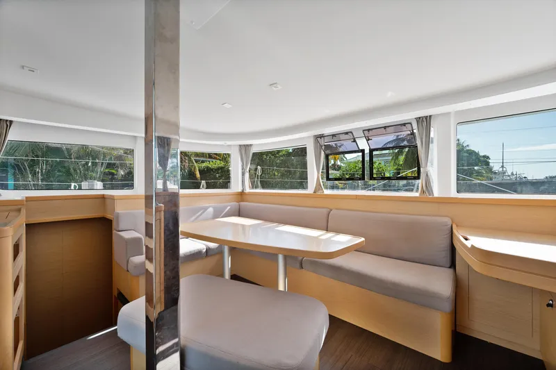 Curvy Mermaid Yacht Photos Pics Interior of 2017 Lagoon 42 catamaran with spacious seating and large windows.