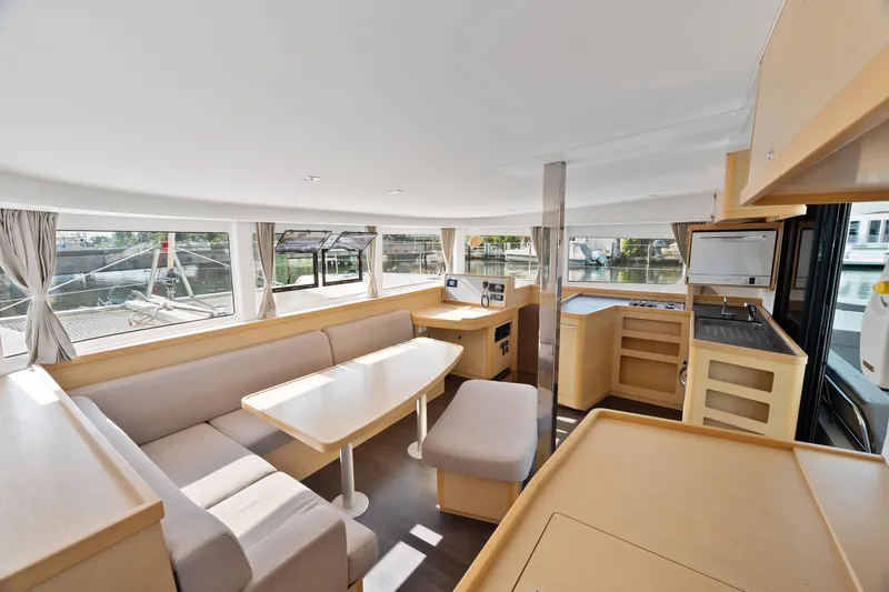 Curvy Mermaid Yacht Photos Pics Interior of 2017 Lagoon 42 catamaran with modern kitchen and spacious seating area.