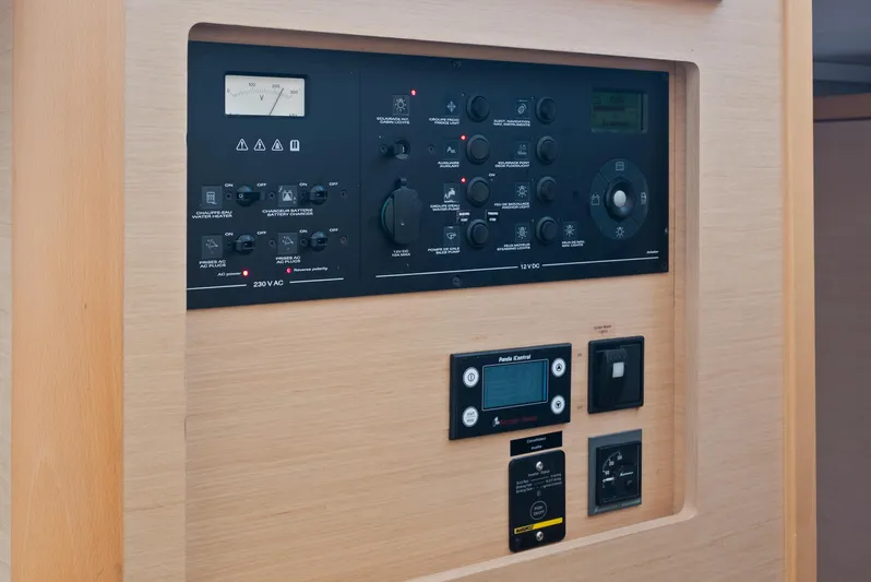 Curvy Mermaid Yacht Photos Pics Control panel of a 2017 Lagoon 42 yacht, featuring various switches and gauges.