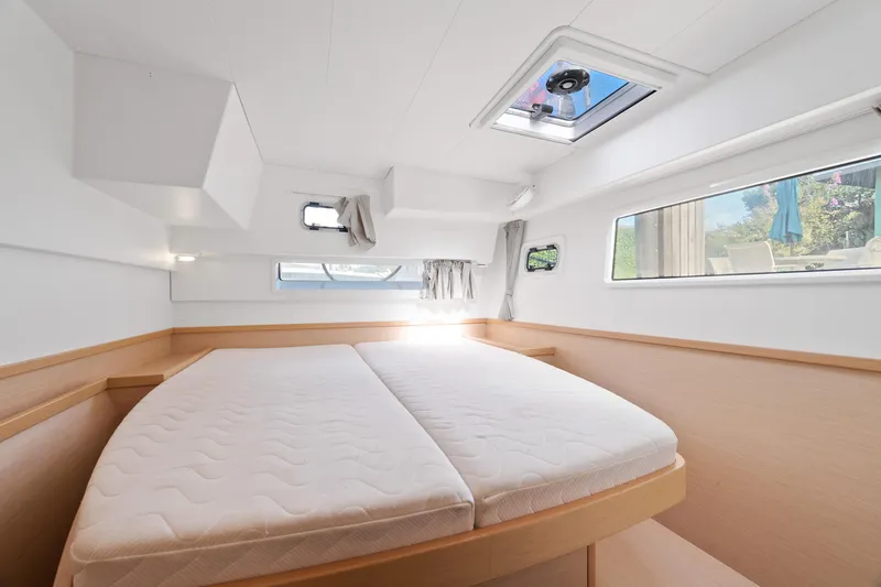 Curvy Mermaid Yacht Photos Pics 2017 Lagoon 42 yacht cabin with double bed, natural light, and modern design.