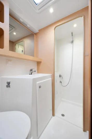 Curvy Mermaid Yacht Photos Pics Modern bathroom in 2017 Lagoon 42 yacht with shower and sink.