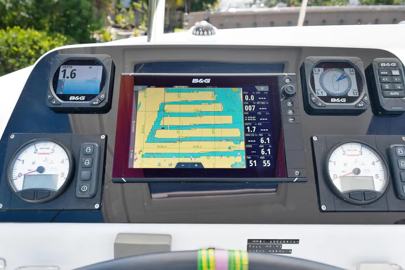 Curvy Mermaid Yacht Photos Pics Control panel of a 2017 Lagoon 42 catamaran with navigation instruments and digital display.