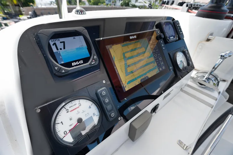 Curvy Mermaid Yacht Photos Pics Control panel of a 2017 Lagoon 42 catamaran with navigation and depth instruments.
