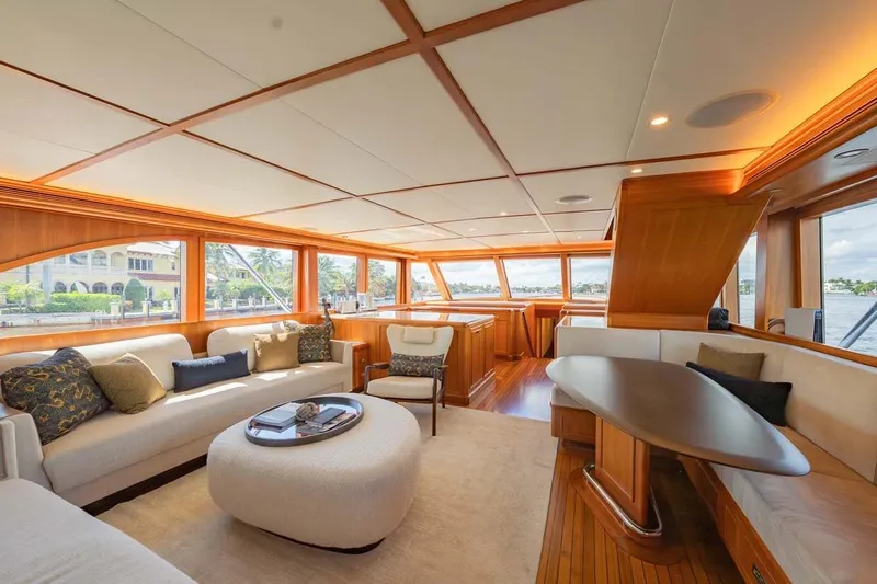 Catch Yacht Photos Pics Luxurious interior of 1984 Feadship Yacht Fish with elegant seating and panoramic windows.