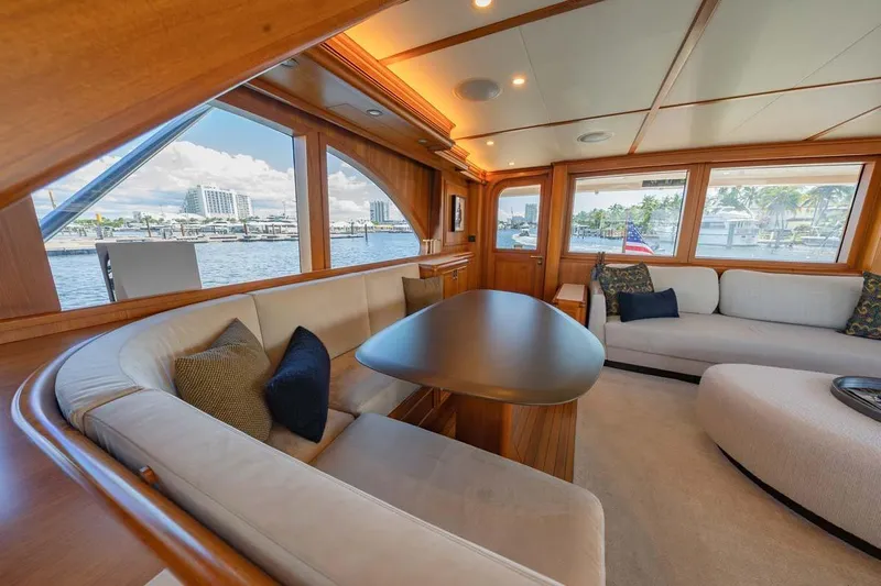 Catch Yacht Photos Pics Luxurious 1984 Feadship Yacht Fish interior with elegant seating and waterfront views.