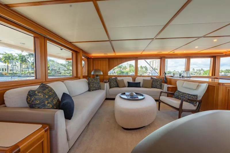 Catch Yacht Photos Pics Luxurious interior of 1984 Feadship Yacht Fish with elegant seating and panoramic windows.