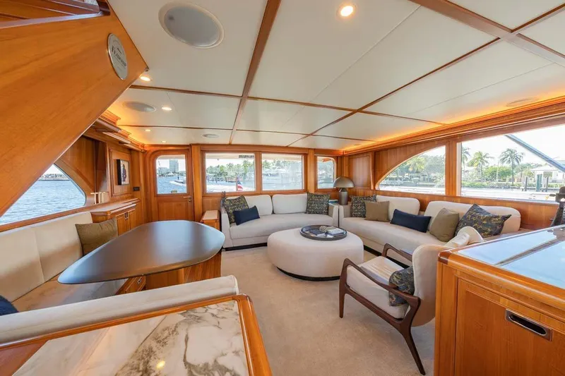 Catch Yacht Photos Pics Luxurious 1984 Feadship Yacht Fish interior with elegant wood paneling and plush seating.