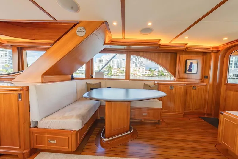 Catch Yacht Photos Pics Luxurious 1984 Feadship Yacht Fish interior with elegant wood finish and cozy seating area.