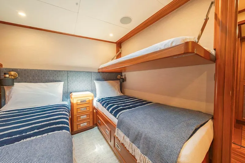 Catch Yacht Photos Pics Luxurious 1984 Feadship Yacht Fish cabin with twin beds and elegant wood finishes.