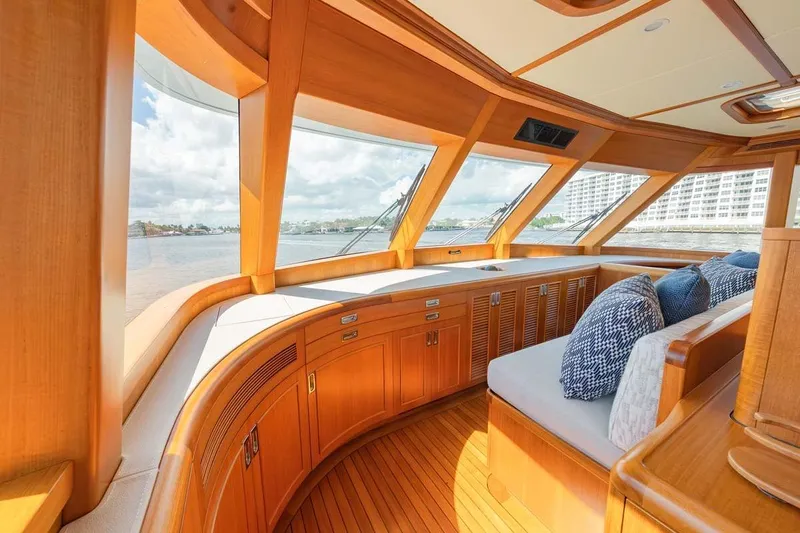 Catch Yacht Photos Pics Luxurious 1984 Feadship Yacht Fish interior with wooden finish and scenic ocean view.
