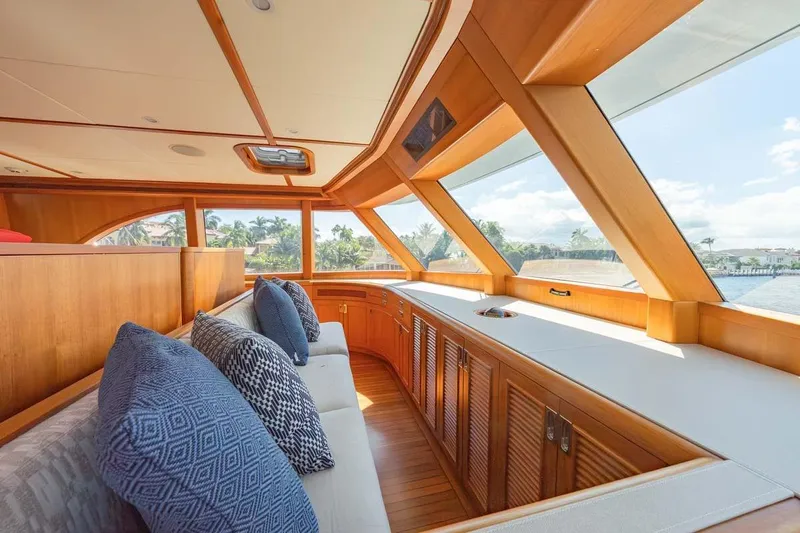 Catch Yacht Photos Pics Luxurious interior of 1984 Feadship Yacht Fish with wooden accents and plush seating.