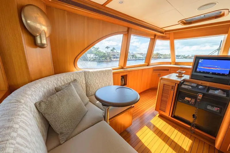Catch Yacht Photos Pics Luxurious 1984 Feadship Yacht Fish interior with plush seating and navigation equipment.