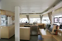 Interior of 2013 Lagoon 52 F yacht, featuring modern kitchen and navigation area.