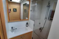 Bathroom interior of 2013 Lagoon 52 F yacht with shower and vanity.