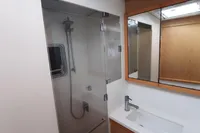 Modern bathroom interior of 2013 Lagoon 52 F yacht with shower and sink.