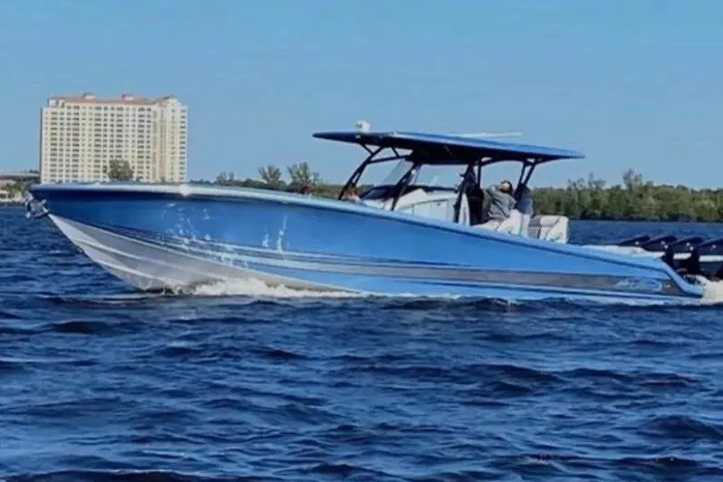  Yacht Photos Pics 2021 Nor-Tech 390 Sport Center Console boat cruising on open water.