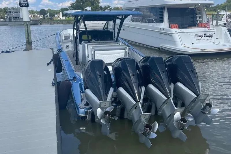  Yacht Photos Pics 2021 Nor-Tech 390 Sport Center Console with four powerful outboard engines docked.