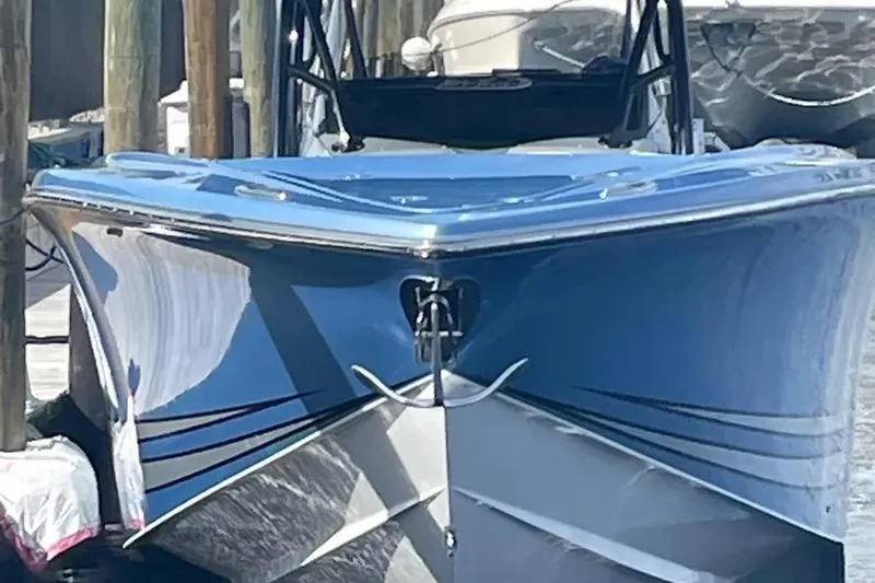  Yacht Photos Pics 2021 Nor-Tech 390 Sport Center Console boat docked, showcasing sleek blue hull design.