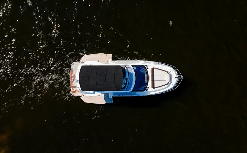 Lei Vola Yacht Photos Pics Aerial view of 2022 Galeon 400 Fly yacht on dark water.
